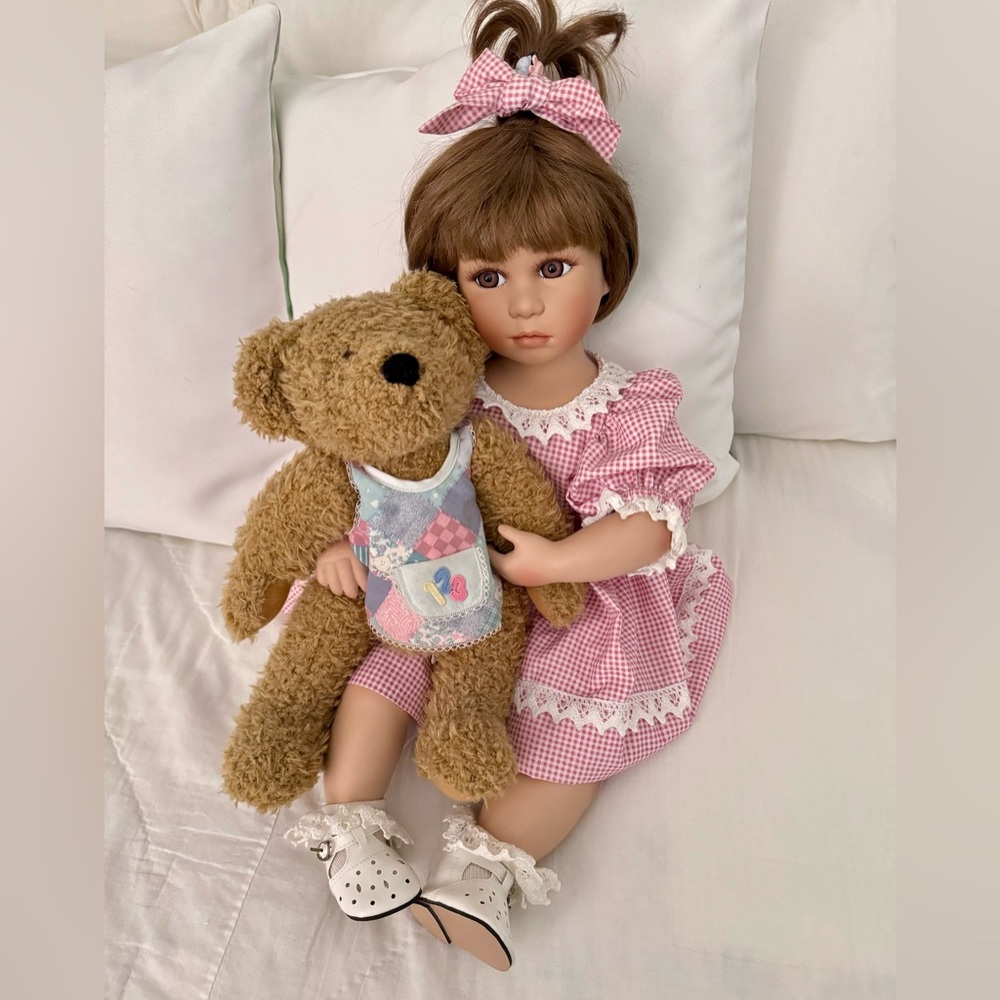 Show stoppers porcelain Brooke doll. Porcelain head, arms, legs. Body fabric.